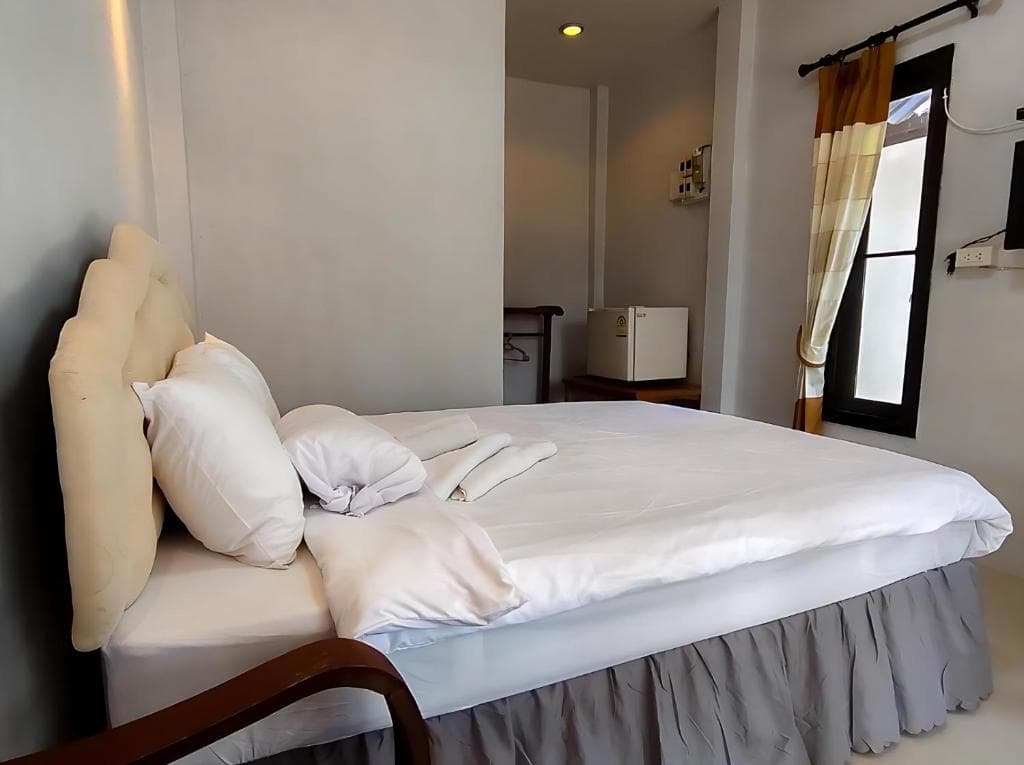Well-appointed guest room at A-Thip House Pai